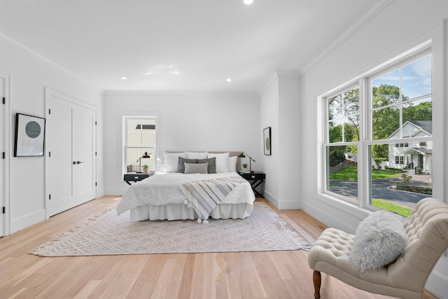 32 Middleville Rd Unit 2, Northport, NY 11768 - bedroom featuring crown molding, multiple windows, light wood-style floors, and recessed lighting
