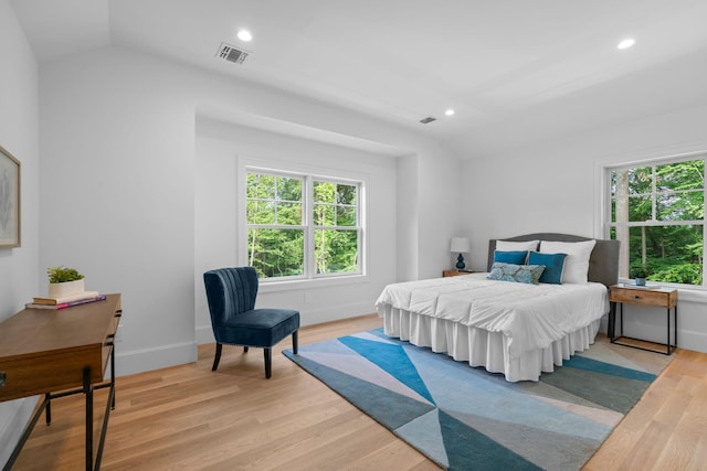 32 Middleville Rd Unit 2, Northport, NY 11768 - bedroom with light wood finished floors, vaulted ceiling, recessed lighting, and an office area