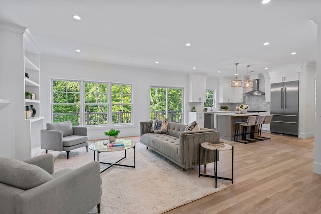 30 Middleville Rd, Northport, NY 11768 - living room with plenty of natural light, recessed lighting, light wood-style floors, and ornamental molding