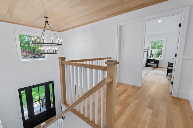 30 Middleville Rd, Northport, NY 11768 - corridor featuring wooden ceiling, an upstairs landing, a chandelier, and light wood-type flooring