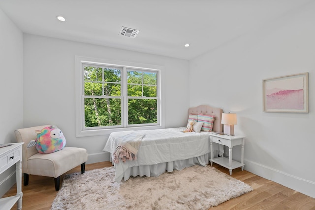 30 Middleville Rd, Northport, NY 11768 - bedroom with wood finished floors and recessed lighting