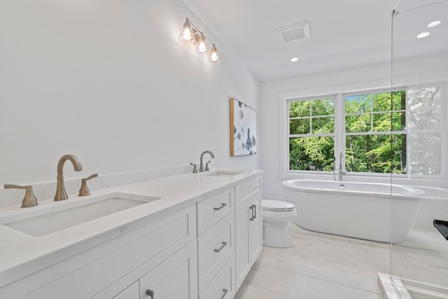 30 Middleville Rd, Northport, NY 11768 - full bath featuring a freestanding bath, double vanity, and recessed lighting