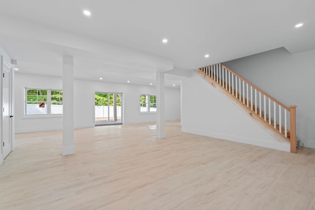 30 Middleville Rd, Northport, NY 11768 - unfurnished living room with recessed lighting, plenty of natural light, stairs, and light wood finished floors