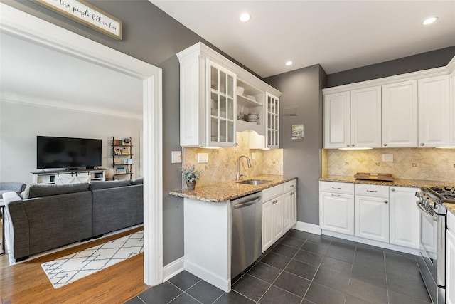 26 Pondfield Rd W Unit 2A, Bronxville, NY 10708 - kitchen with stainless steel appliances, white cabinets, glass insert cabinets, and recessed lighting