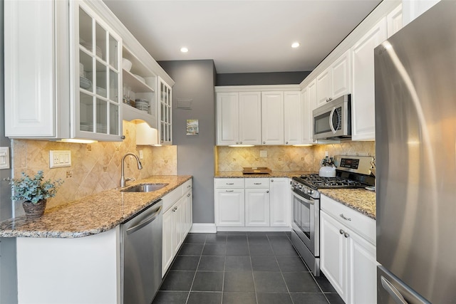 26 Pondfield Rd W Unit 2A, Bronxville, NY 10708 - kitchen with appliances with stainless steel finishes, dark tile patterned flooring, white cabinetry, and recessed lighting