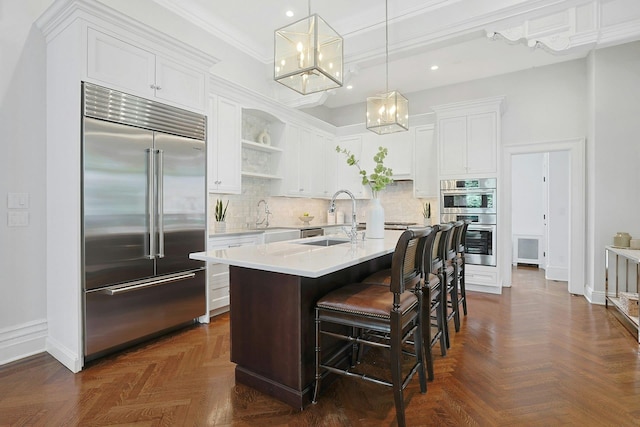 15 Calton Ln, New Rochelle, NY 10804 - kitchen with appliances with stainless steel finishes, open shelves, light countertops, recessed lighting, and a chandelier