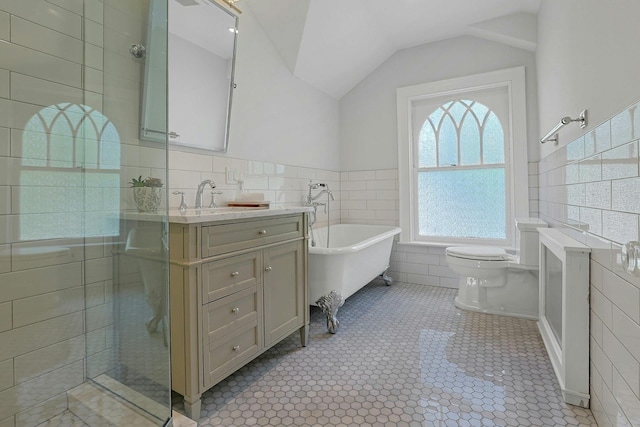 15 Calton Ln, New Rochelle, NY 10804 - bathroom with tile walls, vanity, a soaking tub, lofted ceiling, and a tile shower