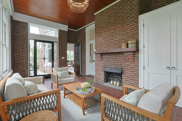15 Calton Ln, New Rochelle, NY 10804 - living room featuring brick wall, wooden ceiling, a fireplace, and a high ceiling
