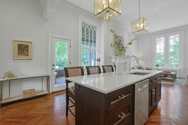 15 Calton Ln, New Rochelle, NY 10804 - kitchen featuring dishwasher, a chandelier, light countertops, a breakfast bar, and decorative light fixtures