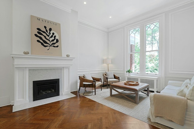 15 Calton Ln, New Rochelle, NY 10804 - living area with a decorative wall, a fireplace, radiator, ornamental molding, and recessed lighting