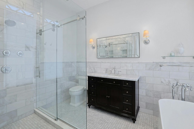 15 Calton Ln, New Rochelle, NY 10804 - full bath featuring tile walls, tile patterned flooring, a freestanding bath, a shower stall, and vanity
