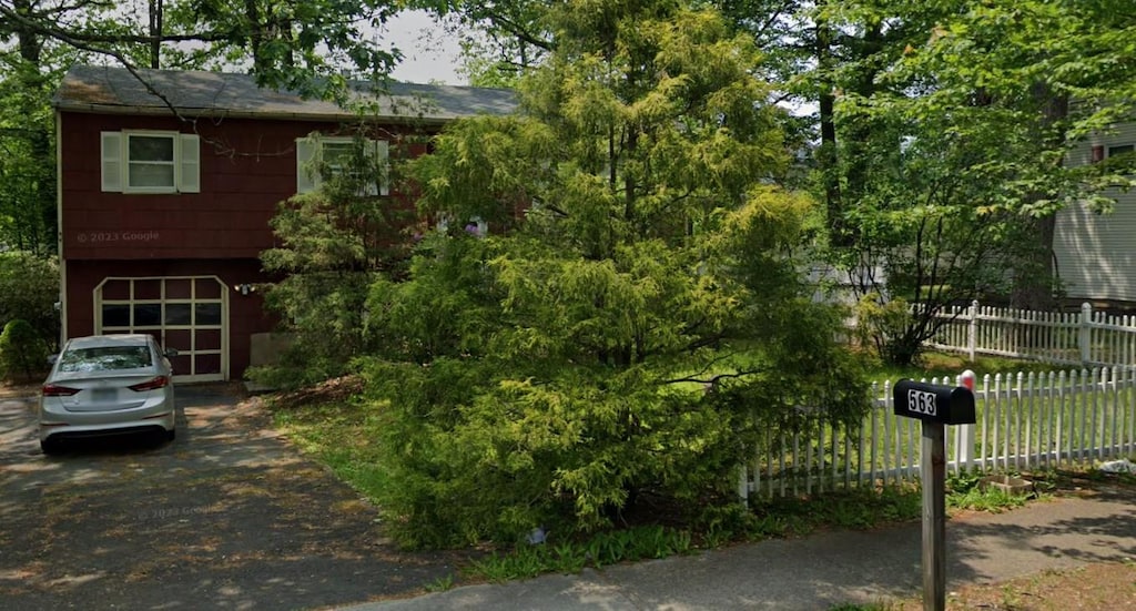 563 Union Rd, Spring Valley, NY 10977 - view of front of property with driveway and an attached garage