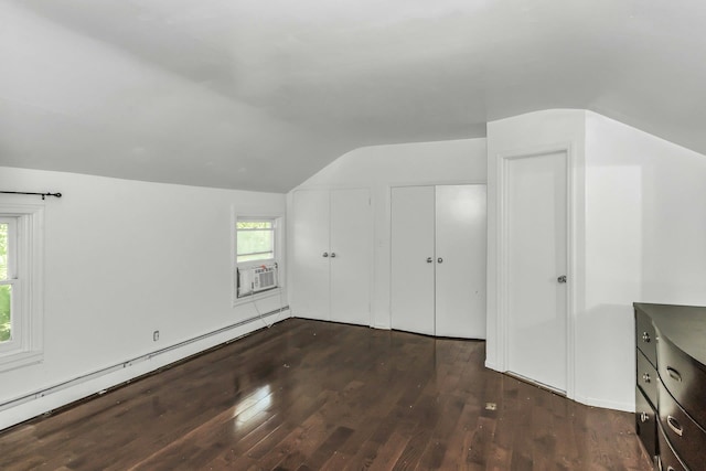 117 Glenwood Rd, Glenwood Landing, NY 11547 - bonus room featuring baseboard heating, lofted ceiling, dark wood-style floors, healthy amount of natural light, and cooling unit