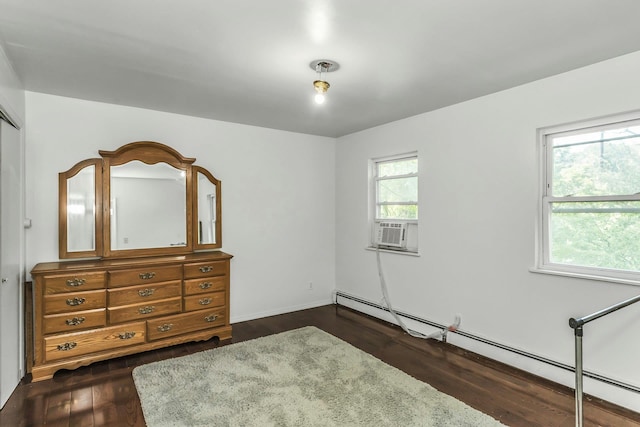 117 Glenwood Rd, Glenwood Landing, NY 11547 - bedroom featuring a baseboard radiator, dark wood-style flooring, and cooling unit