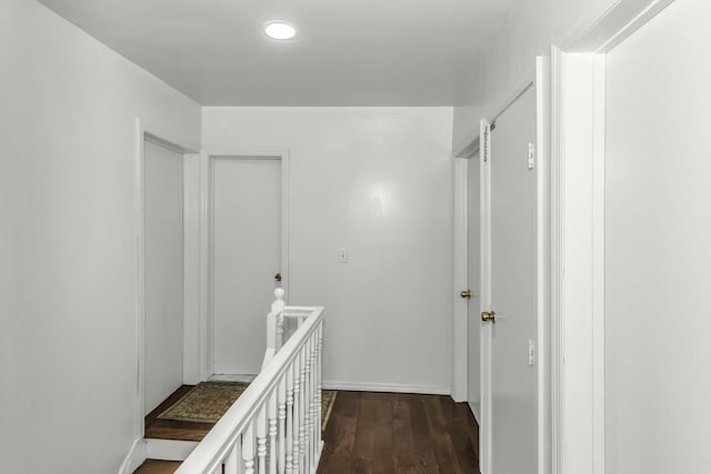 117 Glenwood Rd, Glenwood Landing, NY 11547 - hall featuring an upstairs landing, dark wood-style floors, and recessed lighting
