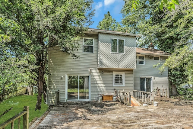 117 Glenwood Rd, Glenwood Landing, NY 11547 - back of house with a deck, a lawn, and a chimney