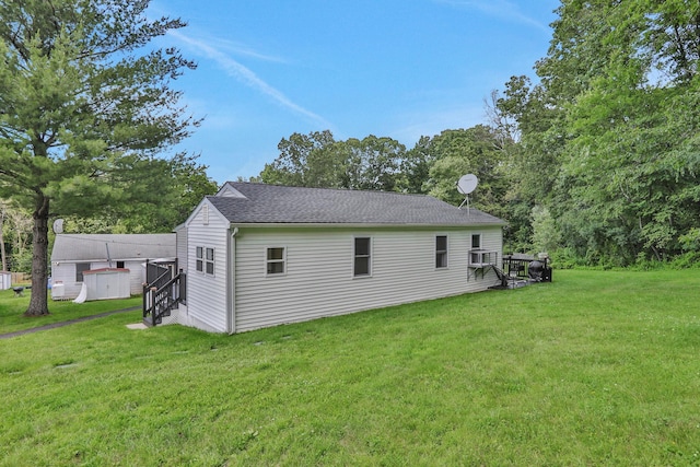 7 Brodie Rd # 17, Hopewell Junction, NY 12533 - rear view of house with a lawn, entry steps, and roof with shingles