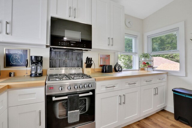 7 Brodie Rd # 17, Hopewell Junction, NY 12533 - kitchen featuring stainless steel gas range oven, black microwave, white cabinetry, and light countertops