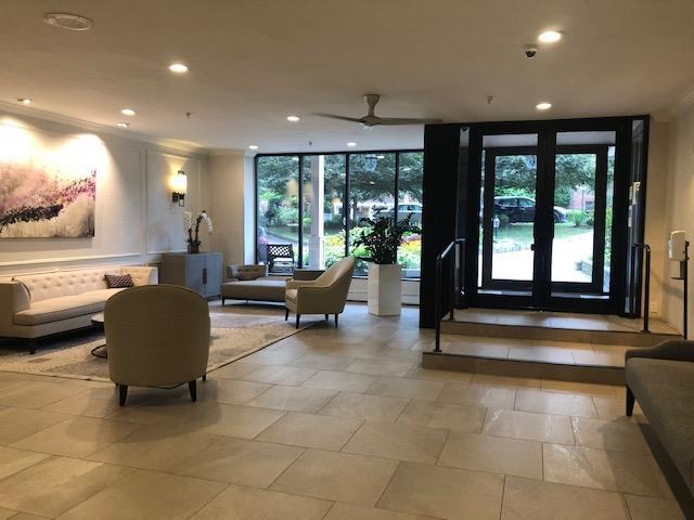 20 Chapel Pl Unit 1H, Great Neck, NY 11021 - building lobby featuring recessed lighting and expansive windows