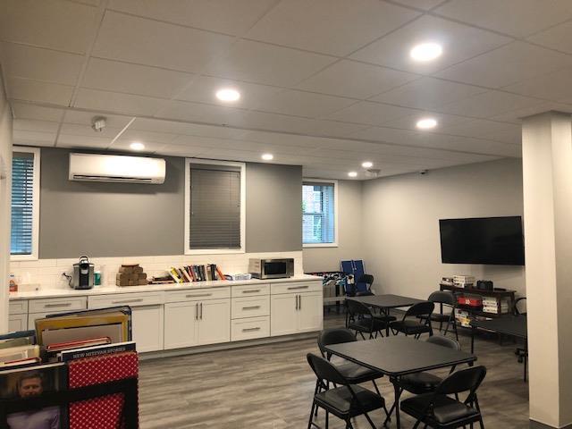 20 Chapel Pl Unit 1H, Great Neck, NY 11021 - rec room featuring a wall mounted air conditioner, recessed lighting, and wood finished floors