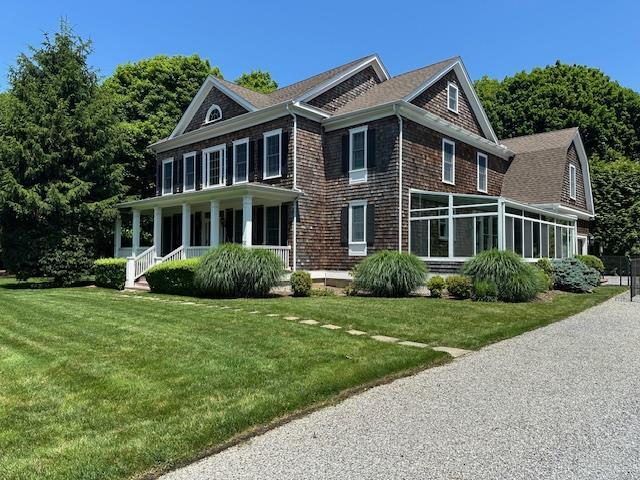 1 Sunset Ave, East Quogue, NY 11942 - view of side of property with a lawn, a porch, and roof with shingles