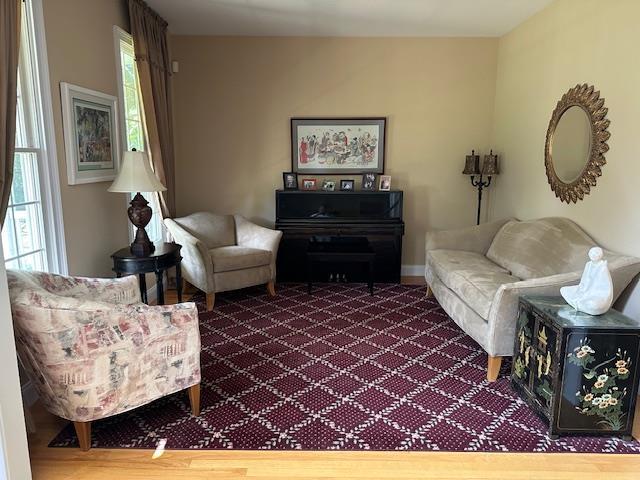 1 Sunset Ave, East Quogue, NY 11942 - living room with carpet flooring