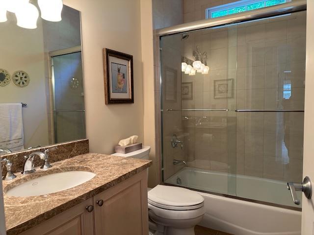 1 Sunset Ave, East Quogue, NY 11942 - full bath featuring vanity and shower / bath combination with glass door
