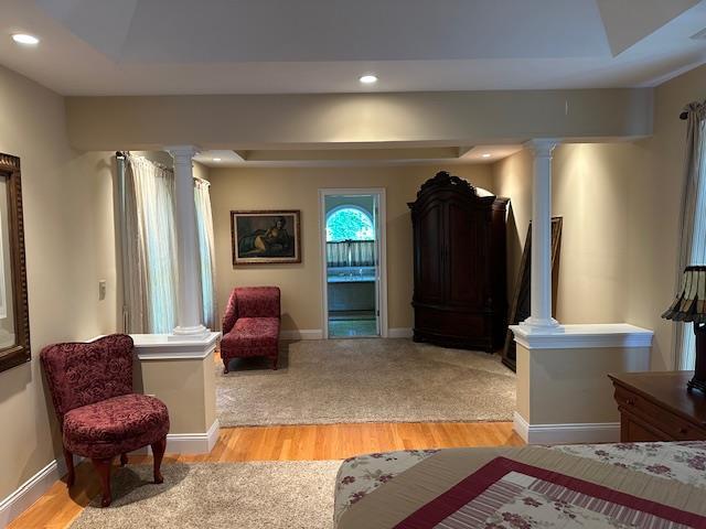 1 Sunset Ave, East Quogue, NY 11942 - living area featuring ornate columns, recessed lighting, and light wood-type flooring