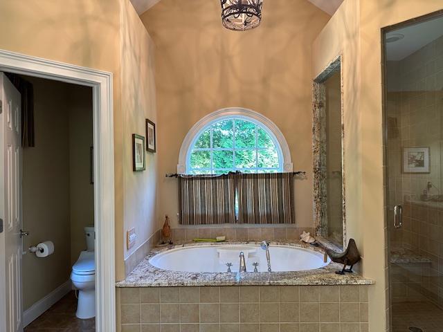 1 Sunset Ave, East Quogue, NY 11942 - bathroom with a bath, a shower stall, and tile patterned floors