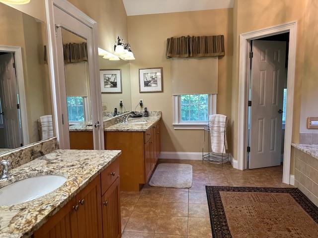 1 Sunset Ave, East Quogue, NY 11942 - bathroom featuring two vanities and tile patterned flooring