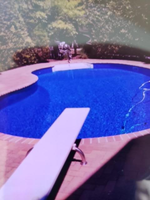 1 Sunset Ave, East Quogue, NY 11942 - outdoor pool featuring a diving board