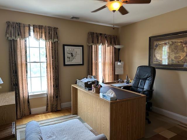 1 Sunset Ave, East Quogue, NY 11942 - office with ceiling fan, healthy amount of natural light, and wood finished floors