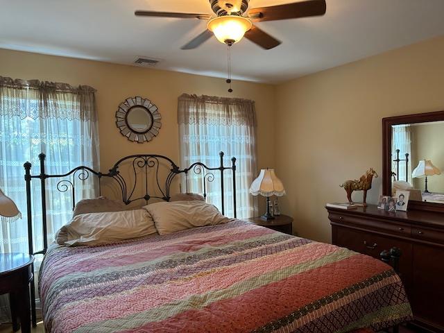 1 Sunset Ave, East Quogue, NY 11942 - bedroom with multiple windows and ceiling fan