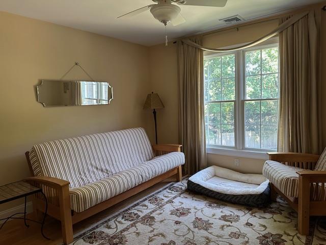 1 Sunset Ave, East Quogue, NY 11942 - living area with a ceiling fan