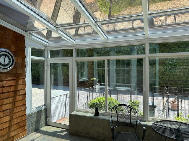 1 Sunset Ave, East Quogue, NY 11942 - sunroom featuring coffered ceiling and a skylight