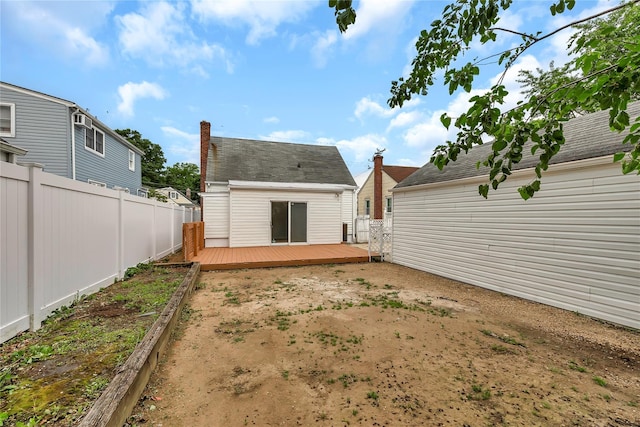 189 Jacob St, Elmont, NY 11003 - back of property with a wooden deck and a fenced backyard
