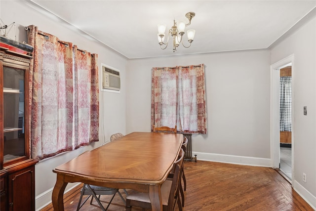 35 Juniper Ave, Mineola, NY 11501 - dining space with a chandelier, wood finished floors, and a wall unit AC