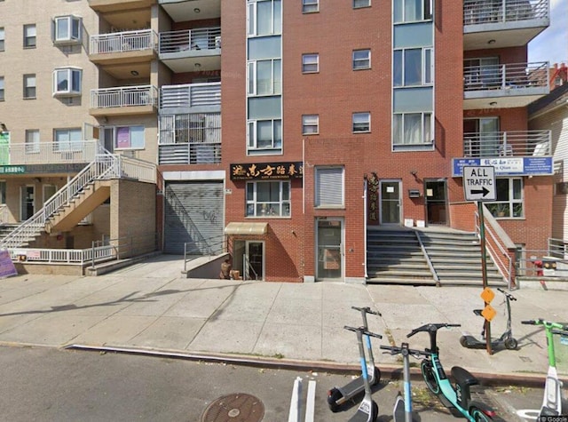 140-37 Cherry Ave Unit 2C, Flushing, NY 11355 - view of apartment building / complex with an attached garage and concrete driveway