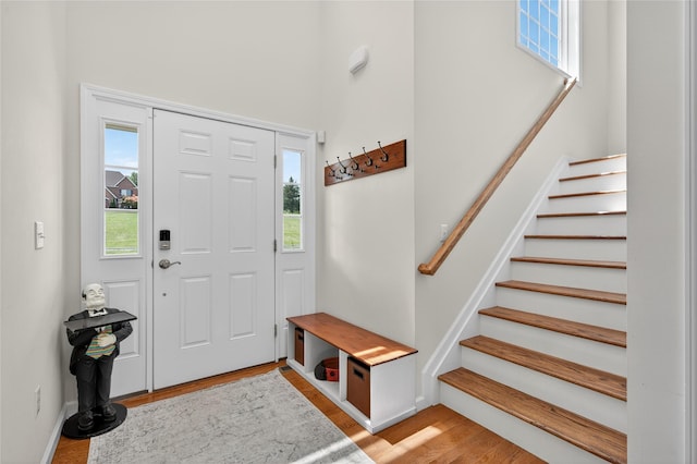 2 Primrose Ln, Chester, NY 10918 - entryway featuring stairs, a towering ceiling, and light wood finished floors