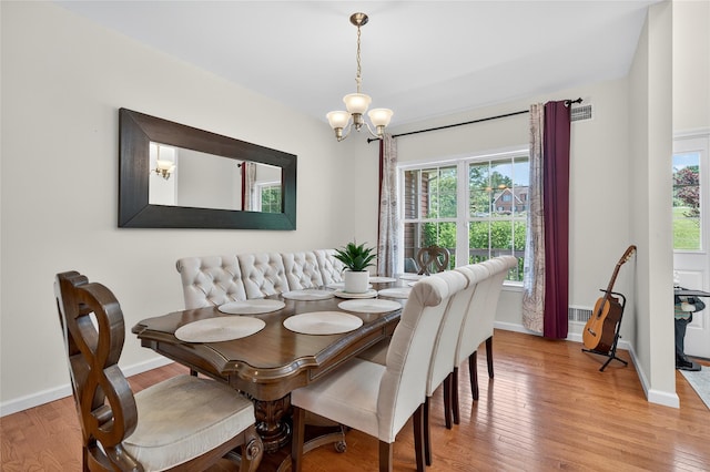 2 Primrose Ln, Chester, NY 10918 - dining room with plenty of natural light, a chandelier, and light wood finished floors