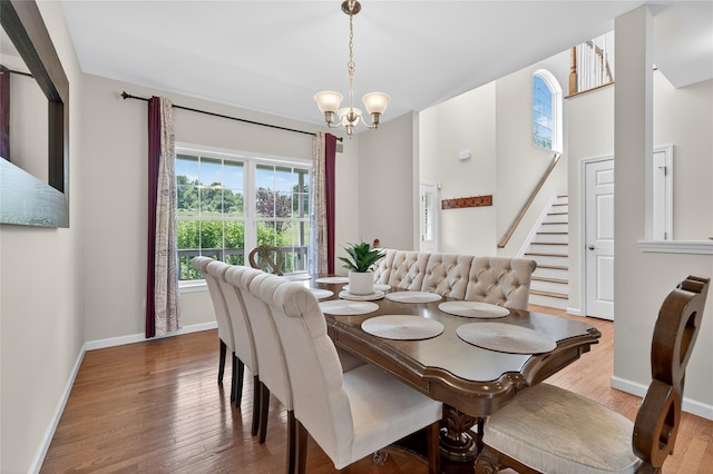 2 Primrose Ln, Chester, NY 10918 - dining space with a chandelier, stairs, and wood finished floors
