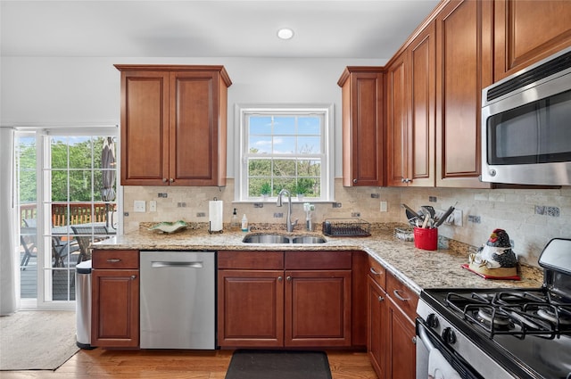 2 Primrose Ln, Chester, NY 10918 - kitchen featuring stainless steel appliances, plenty of natural light, light stone counters, and recessed lighting
