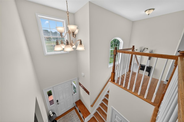 2 Primrose Ln, Chester, NY 10918 - entryway with a chandelier, wood finished floors, and a high ceiling