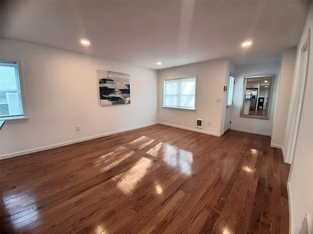 8 Poplar St, Poughkeepsie, NY 12601 - unfurnished living room with dark wood-style floors and recessed lighting