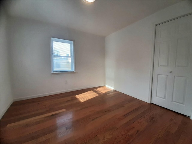 8 Poplar St, Poughkeepsie, NY 12601 - unfurnished bedroom featuring wood finished floors and baseboards