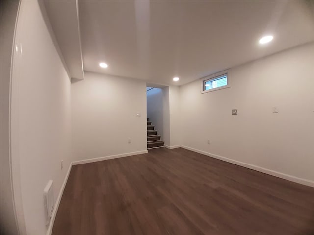 8 Poplar St, Poughkeepsie, NY 12601 - basement with dark wood-style flooring, recessed lighting, and stairway
