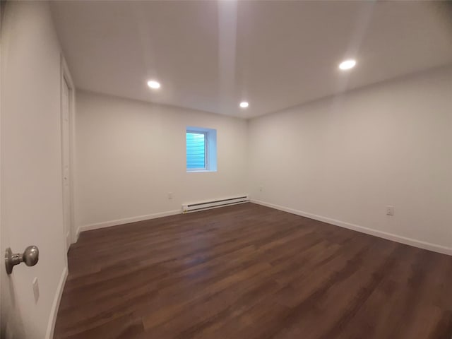 8 Poplar St, Poughkeepsie, NY 12601 - spare room with a baseboard radiator, recessed lighting, and dark wood-type flooring