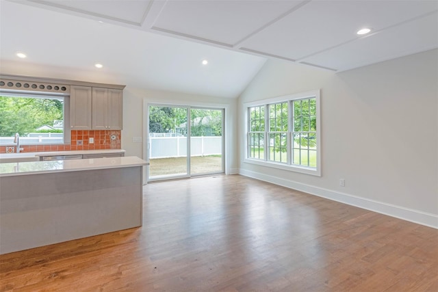 130 Sunset Ln, Greenport, NY 11944 - kitchen with light countertops, healthy amount of natural light, light wood finished floors, recessed lighting, and lofted ceiling