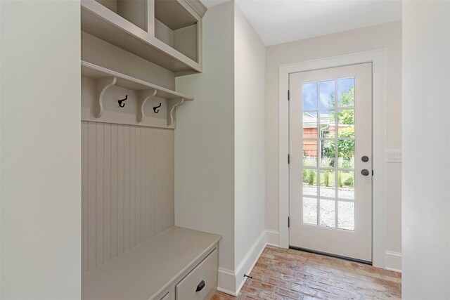 130 Sunset Ln, Greenport, NY 11944 - mudroom with brick floors and baseboards