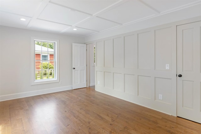 130 Sunset Ln, Greenport, NY 11944 - unfurnished bedroom with wood finished floors, coffered ceiling, and recessed lighting
